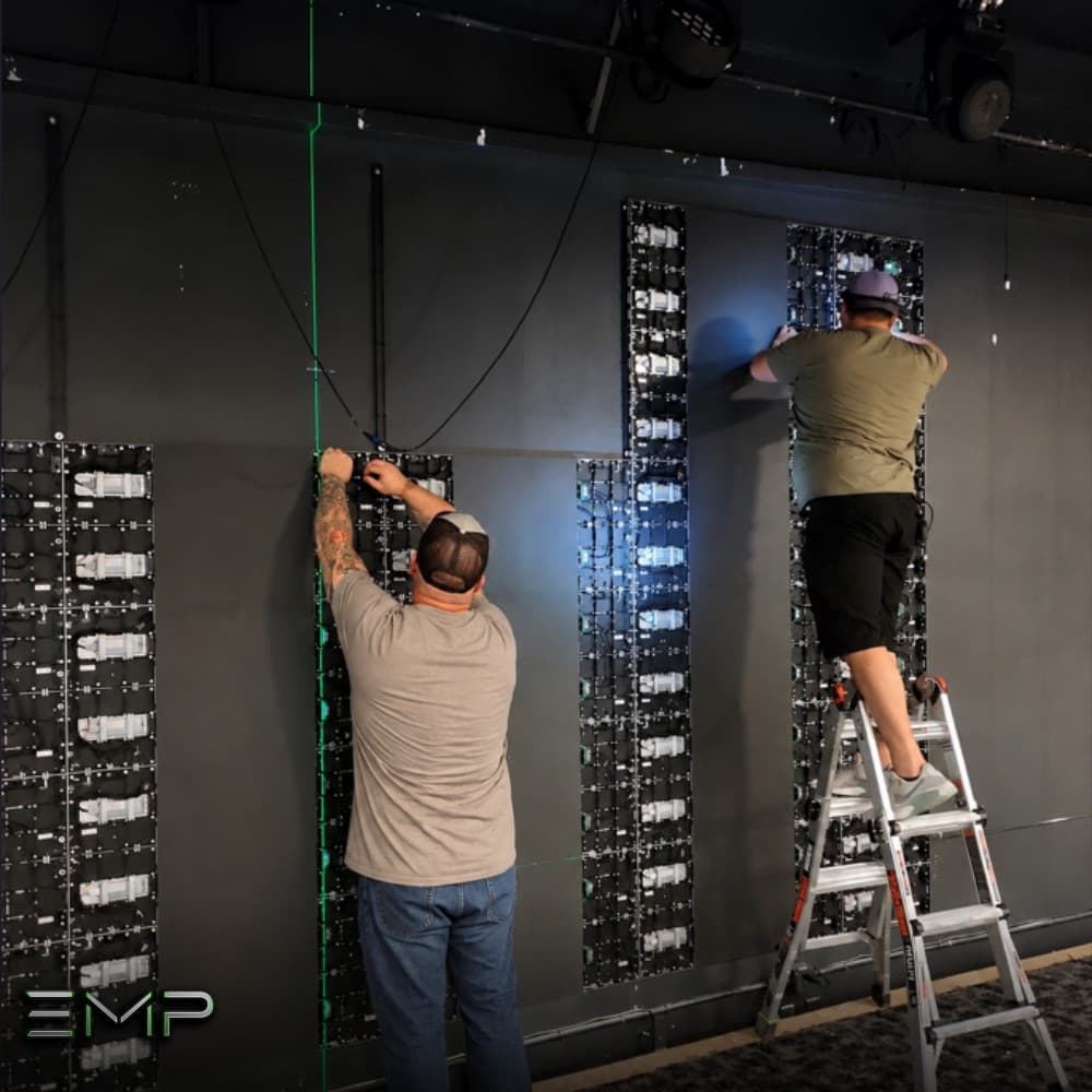 Eternity Music Productions team installing LED wall panels